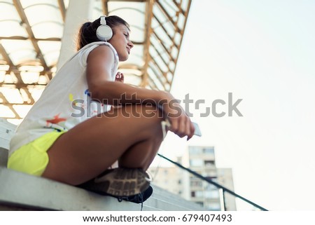 Similar – Foto Bild fröhliche Frau mit langen Haaren auf Kopfhörer hört Musik.