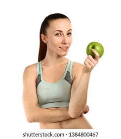 Sporty woman with apple on white background