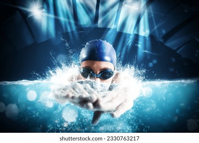 Sporty woman athlete swims with energy during a competition in the pool