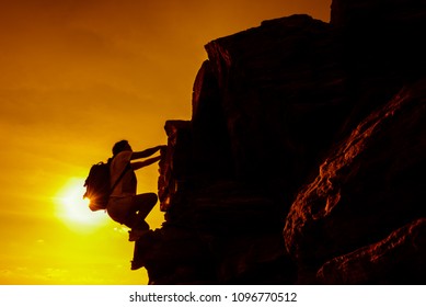 Sporty Woman Climbing On The Cliff. Personal Transformation For Business Successful Concept. Business Development And Improvement. Strong And Healthy For Outdoor Activity.