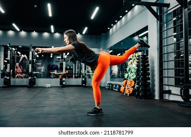 A Sporty Woman Does Single Leg Balance In Gym.