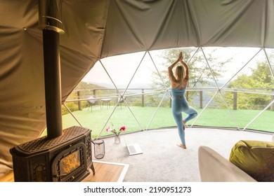 Sporty Woman Doing Exercise In A Geo Dome Glamping Tent