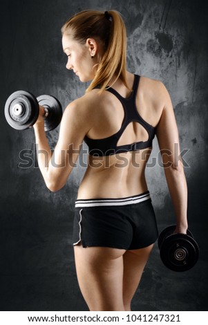 Similar – Rear view portrait of one young middle age athletic woman at crossfit training, exercising with trx suspension fitness straps over dark background