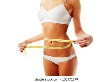 sporty woman and measure around her body on white background