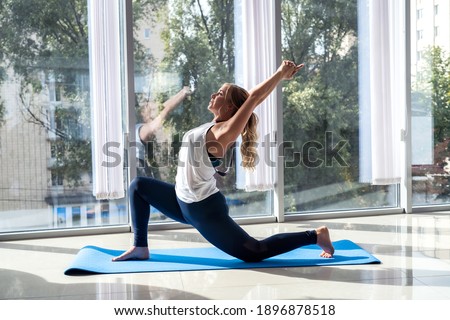 sporty woman relax exercising on yoga mat, rehabilitation fitness.  healthy lifestyle