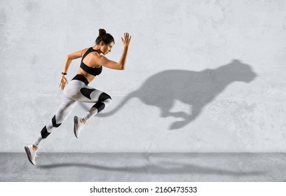 Sporty woman running on grey wall background wearing in sportswear. Sport and fitness motivation banner - Shutterstock ID 2160473533