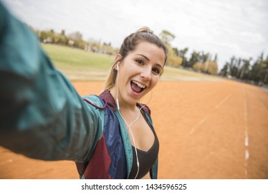 Sporty Woman Taking Selfie On Stadium Track