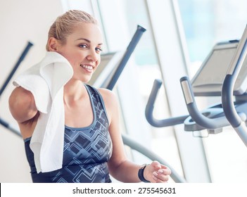 Sporty Woman With Towel In Gym After Training