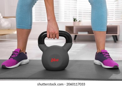 Sporty Woman Training With Kettlebell At Home, Closeup