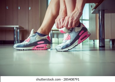 Sporty Woman Tying Her Shoelaces Close Up