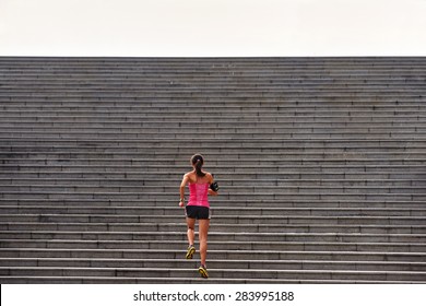sporty woman working out running up stairs outdoors for morning workout - Shutterstock ID 283995188