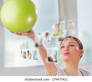 Sporty Woman Working Out Using Modern Virtual Interface. Online Fitness Trainer Concept