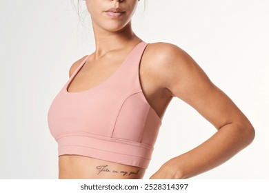 Sporty Women's pink sports bra active sportswear mockup, Portrait of woman in sportswear ready to workout. Sportive woman showing sportswear mockup and ready to exercise training - Powered by Shutterstock