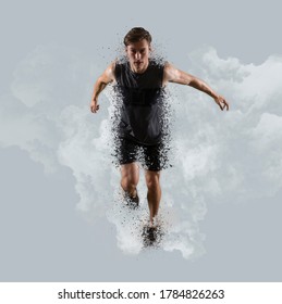 Sporty Young Man Running On Smoke Background. Sports Banner. Shatter Effect 