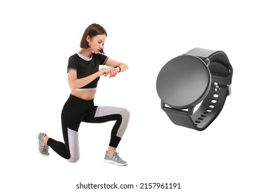 Sporty young woman checking her pulse and big smartwatch with blank screen on white background 