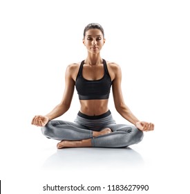 Sporty young woman doing yoga practice isolated on white background. Concept of healthy life and natural balance between body and mental development. Full length - Shutterstock ID 1183627990