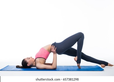 Sporty young woman doing yoga practice isolated on white background - concept of healthy life and natural balance between body and mental development