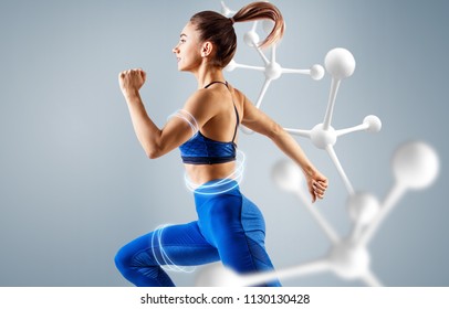Sportliche junge Frau, die in der Nähe von Molekülen läuft und springt. Metabolismus