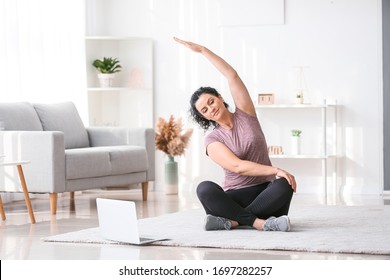 Sporty Young Woman Training At Home