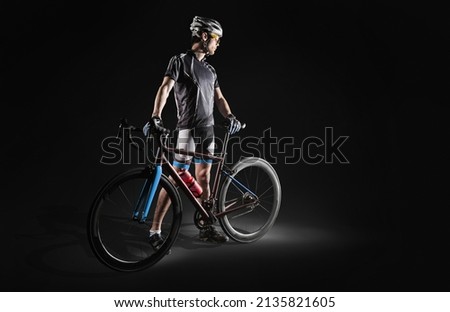 Spost background with copyspace. Cyclist. Dramatic colorful close-up portrait.