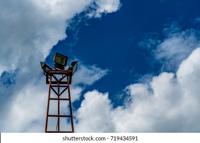 Spot light pole on cloud and blue sky background
