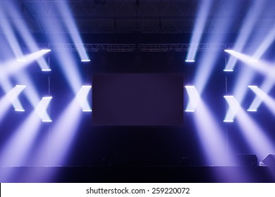 Spot Lights On A Empty Stage With Blank Screen In The Middle Before A Big Concert