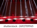 A spotlight on an empty stage.