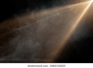 spotlight on stage or gods rays with particles isolated on black background	