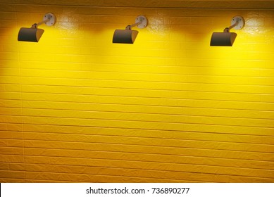 Spotlight And Yellow Wall