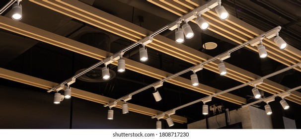 Spotlights set hanging on the ceiling. Track LED-lighting system