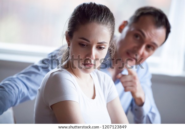 Spouses quarreling at home, frustrated wife
listen claims from angry husband, focus of female. Head shot
married couple have bad difficult relations. Break up unexpected
pregnancy and divorce
concept