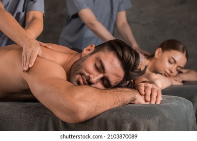 Spouses Resting at Relaxing Massage Therapy Lying With Eyes Closed In Luxury Spa Resort. Aromatherapy, Beauty, Wellness And Relaxation Treatment Concept. Low Light, Selective Focus - Shutterstock ID 2103870089