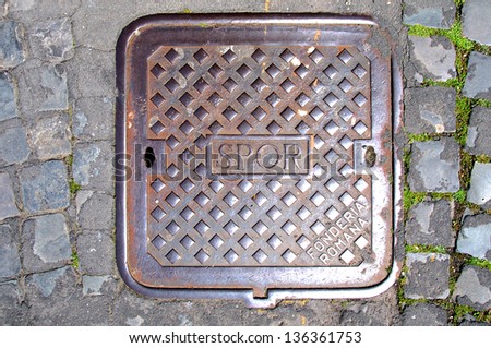 SPQR, typical manhole cover in the Rome streets, Italy