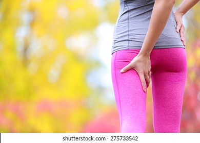 Sprain Hamstring Or Cramps - Running Sports Injury With Female Runner. Closeup Of Woman Back Thigh.