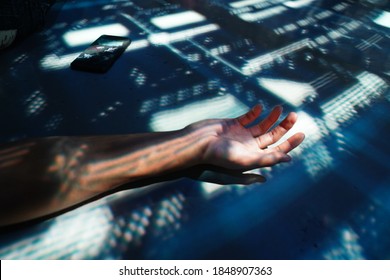 A Sprawled Hand Shone Upon In a Sea of Darkness - Shutterstock ID 1848907363