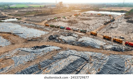 A sprawling landfill site is obscured by vast black plastic sheets, an aerial testament to efforts in containment and environmental management. Landfill background. Aerial view.
 - Powered by Shutterstock