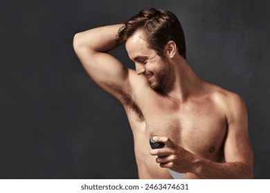 Spray armpit, happy man and perfume for health, hygiene or grooming isolated on black studio background. Product, deodorant and body cosmetics on underarm for scent, wellness or skincare fragrance - Powered by Shutterstock