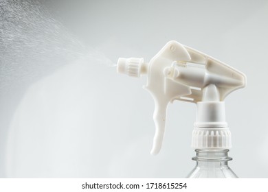 Spray Bottle Spraying Mist  Isolated In White Background