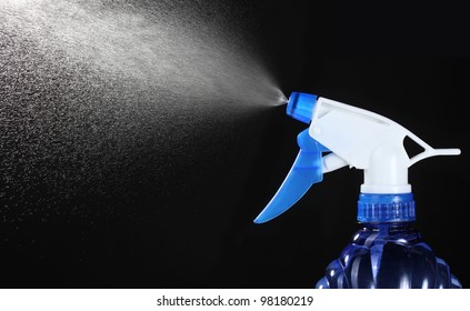 Spray Bottle Spraying On Black Background Stock Photo 98180219