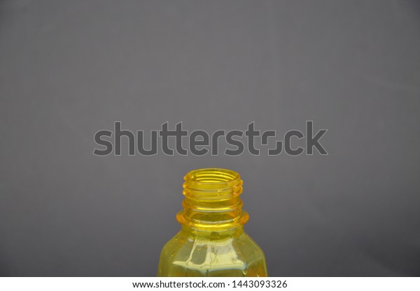 Download Spray Bottle Yellow On Black Background Stock Photo Edit Now 1443093326 PSD Mockup Templates