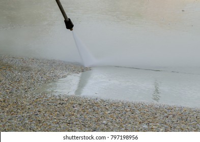 Spray Jet Cleaning Exposed Aggregate Concrete Driveway