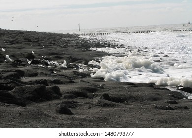 Spray On Tar Beach In The North Sea