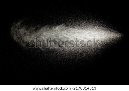 Sprayed water. Splashes and drops of water isolated on black background.