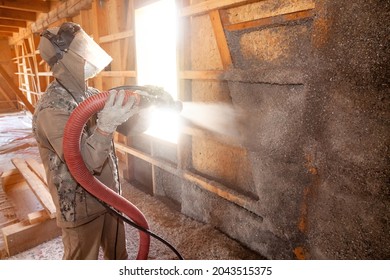 Spraying Cellulose Insulation On The Wall