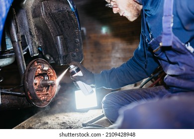 Spraying Copper Grease On The Brake Mechanism, Pads And Other Elements Of The Brake System. The Concept Of Car Chemicals, Car Care Products.