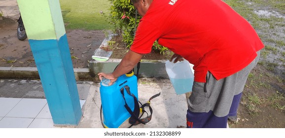 Spraying Disinfectant By The Covid 19 Task Force Outside The Room