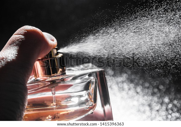 Spraying Perfume On Dark Background Closeup Stock Photo (Edit Now ...