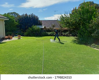 Spraying Weeds In A Lawn With A Boom Sprayer