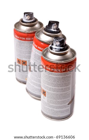 Spraypaint aerosol cans isolated on a white background.