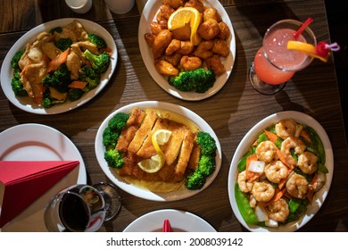 Spread Of Chinese Food On A Table With Drinks